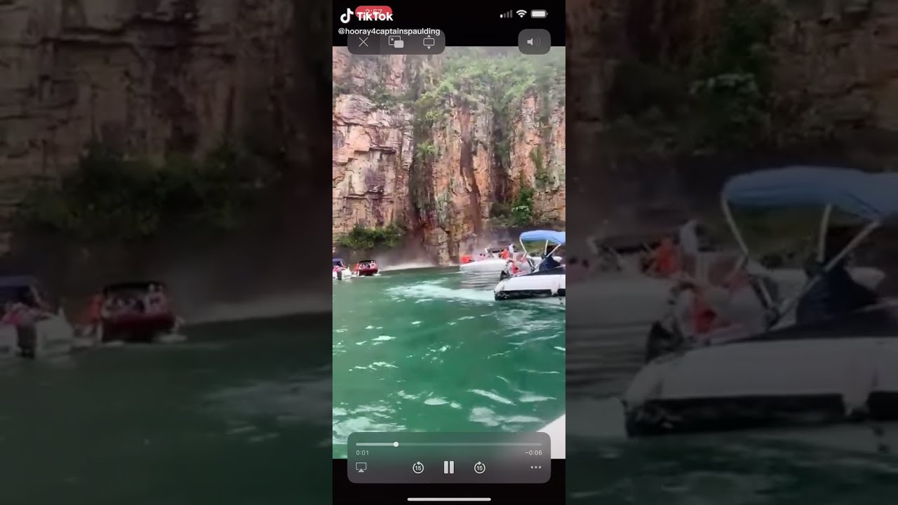 Insane video of part of a cliff falling on boaters in Brazil